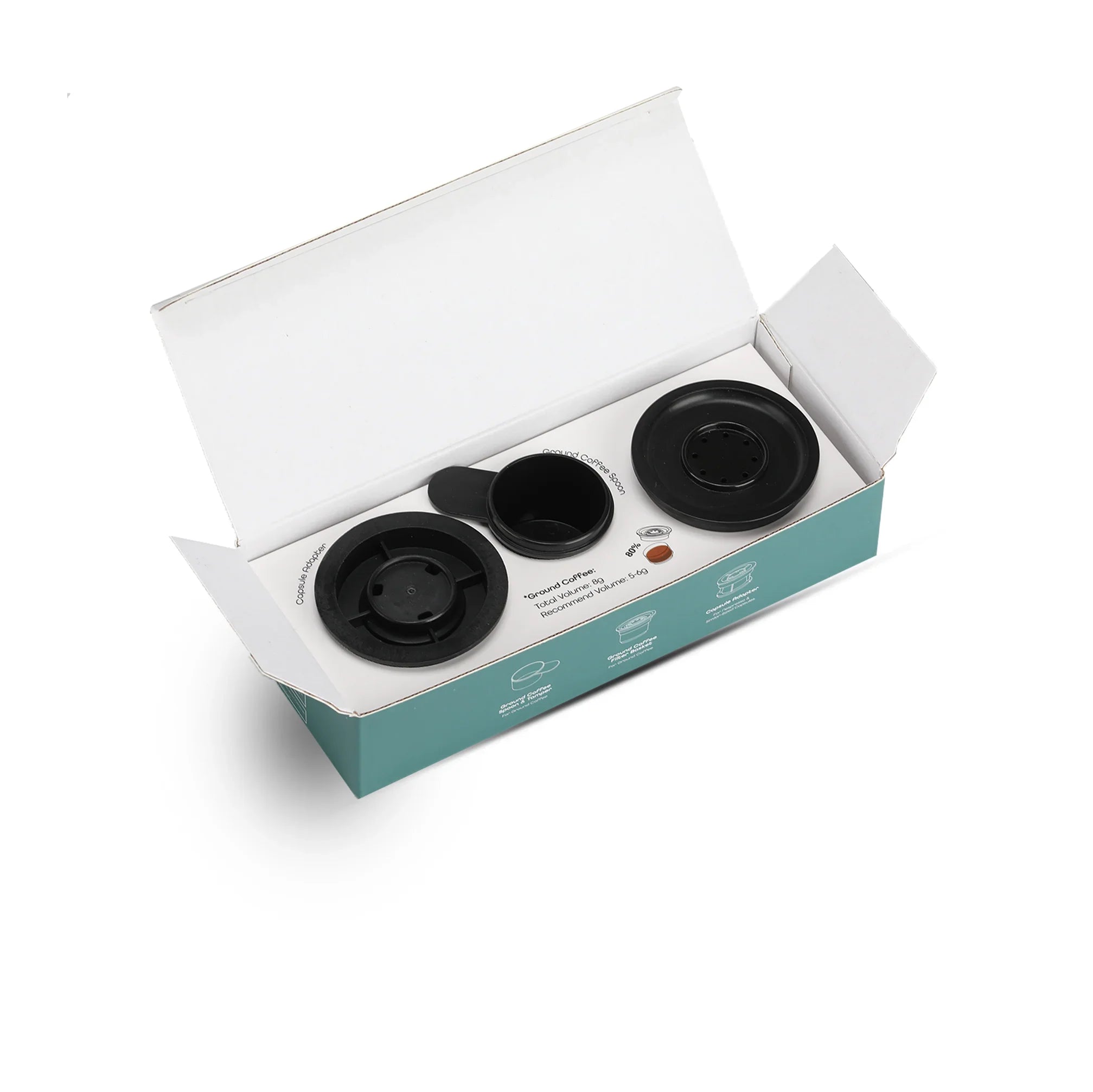 OutIn Nano espresso machine kit with capsule adapter, ground coffee filter, and spoon in open box.