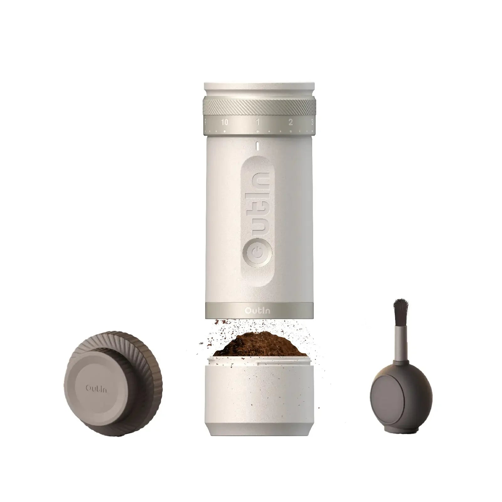 Disassembled white OutIn Fino portable coffee grinder showing grind adjustment, burr, grounds, and cleaning brush.