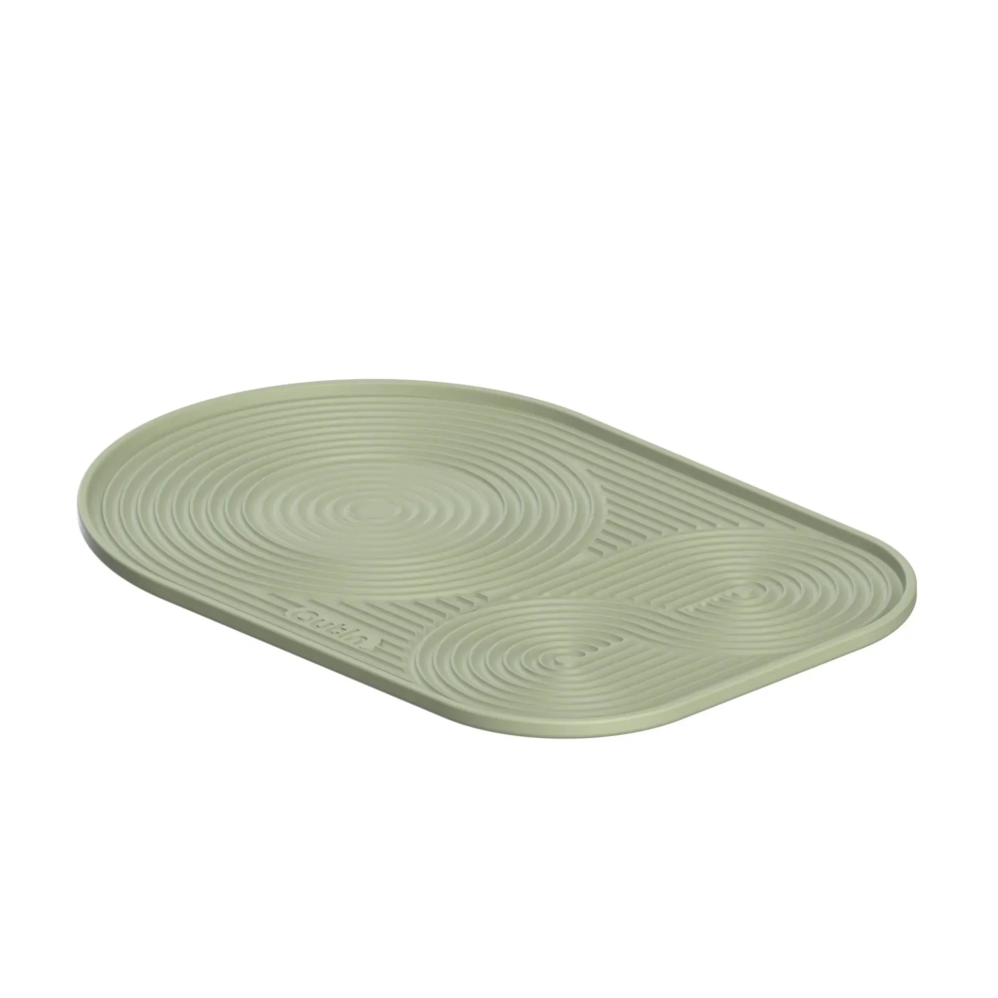 OutIn oval light sage green silicone coffee mat with raised concentric circle and line pattern for drainage and grip.