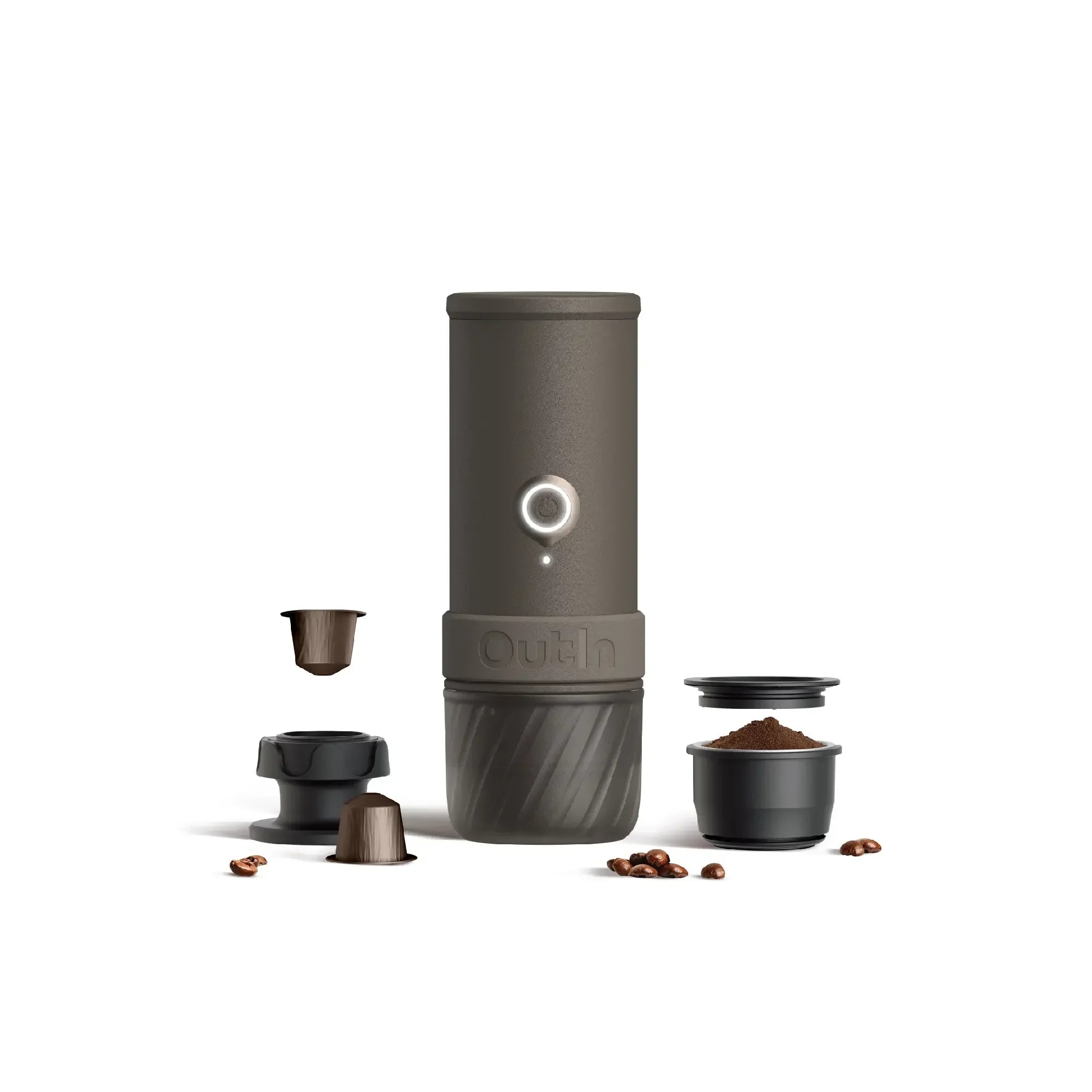 Dark gray OutIn portable espresso machine with coffee pods, grounds, tamper, and beans. Shows product and components.