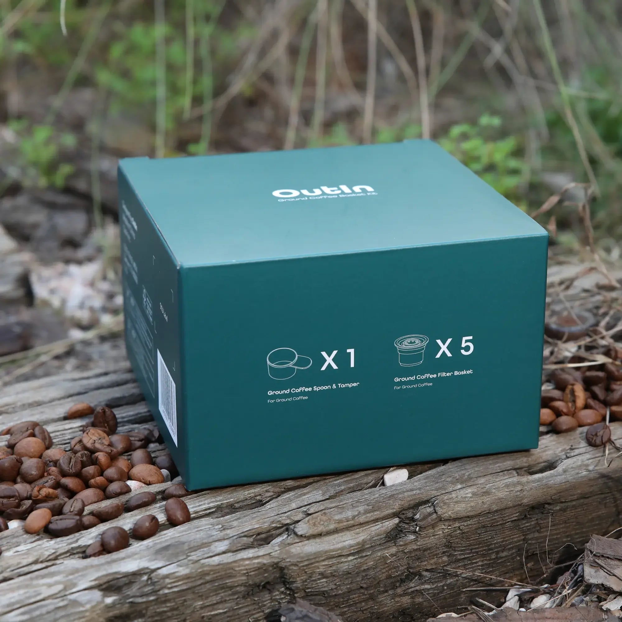 OutIn Nano Portable Espresso Machine ground coffee accessory kit packaging with 1 spoon and 5 filter baskets.