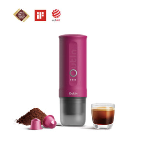 Fuchsia pink OutIn Nano portable espresso machine with espresso shot, coffee grounds, and capsules. Features award logos.