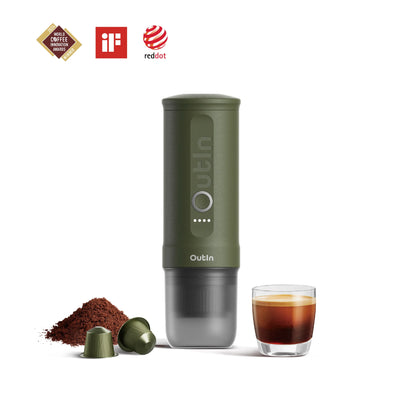 Forest green OutIn portable espresso machine with coffee grounds, capsules, and espresso shot. Awards shown.