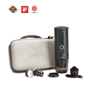 Space Grey Traveler Espresso Gift Set featuring portable espresso maker and protective case, demonstrating compatibility with coffee capsules and ground coffee. Award winning.