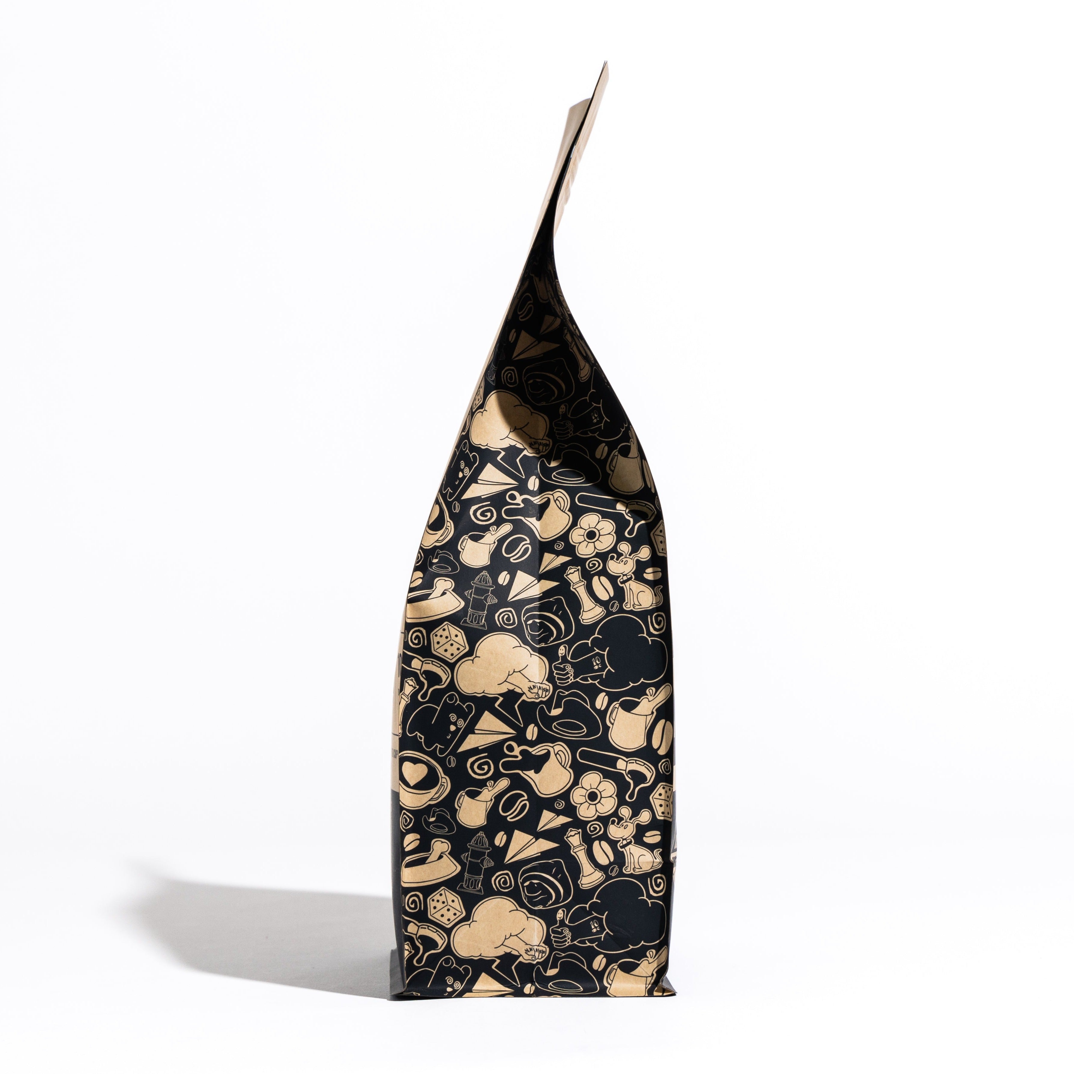 10 FOR TENN dark organic coffee bag with whimsical icons: honey, dark chocolate, pecan taste notes.