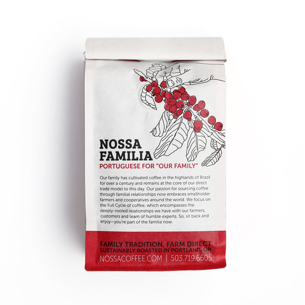 Nossa Familia Camila's Organic coffee bag with illustration of coffee cherries and red berry accents.