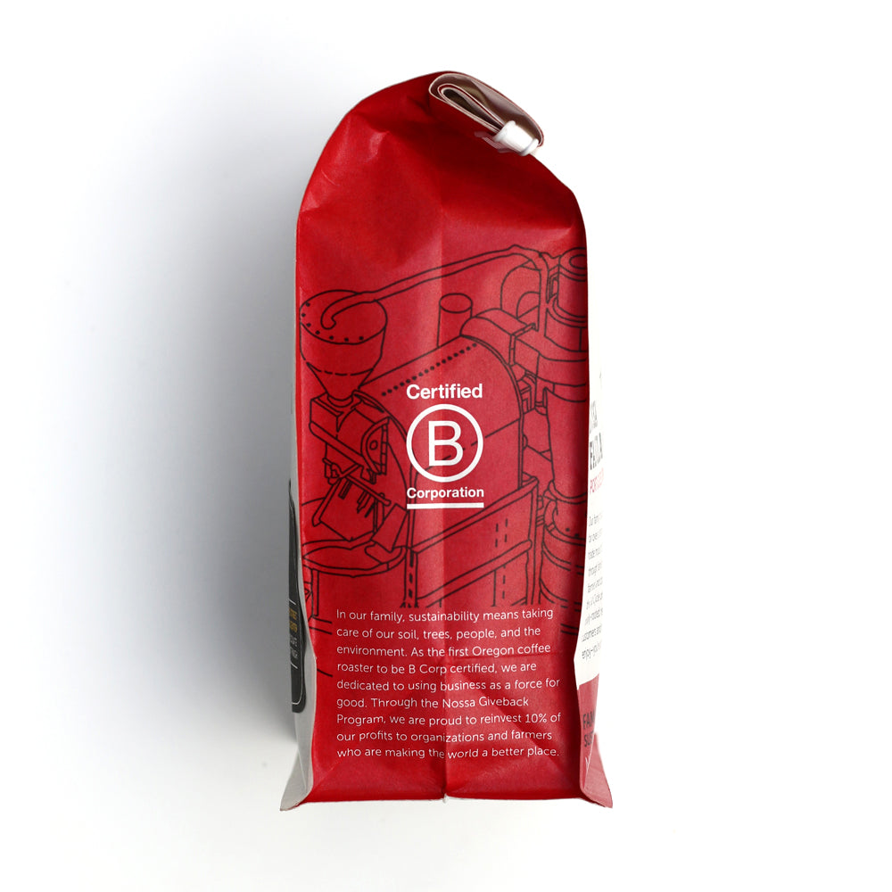 Nossa Familia Augusta's Organic Breakfast coffee bag with Certified B Corporation seal and coffee roaster illustration.