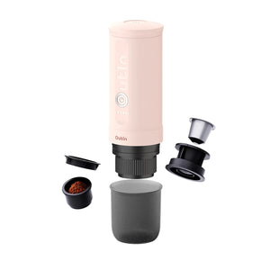 Rose Quartz portable espresso machine disassembled showing coffee grounds basket and reusable capsule for 2-in-1 brewing.