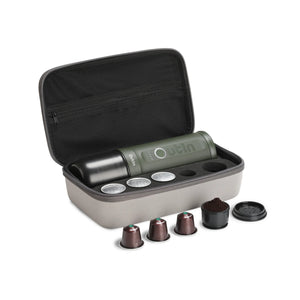 Traveler Espresso Gift Set in forest green, with case, capsules, and ground coffee.
