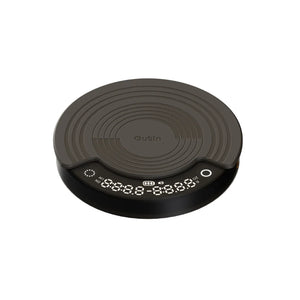 OutIn Claro coffee scale, round, dark gray, with silicone mat and digital display for time, weight, and brewing modes.
