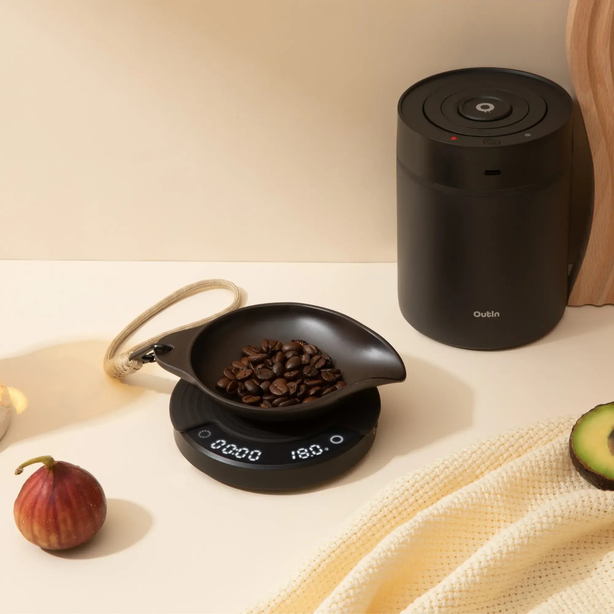 OutIn Rebrew Bean Tray with coffee beans on scale, eco-friendly, with braided lanyard for portability.