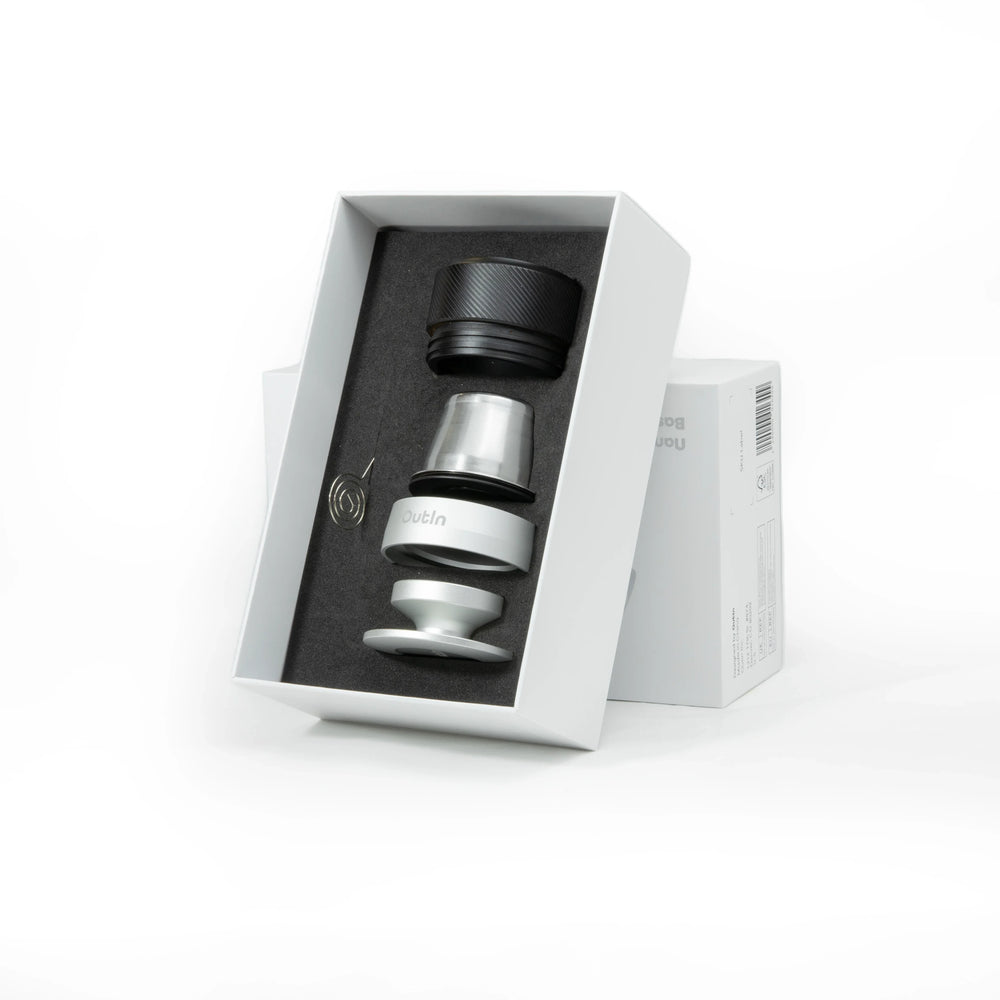 Nano Portable Espresso Machine Basket Plus accessory set in white box: black cap, stainless steel basket, tamper, spring.