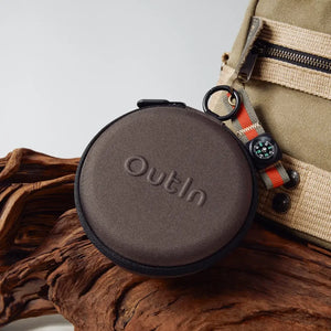 OutIn Claro coffee scale carrying case, dark brown, round, zippered, with embossed OutIn logo, showcasing portability.