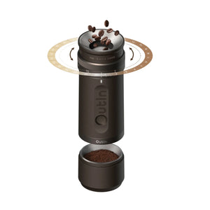 OutIn Fino portable electric coffee grinder in dark brown, with 28 grind settings and coffee beans entering for grinding.